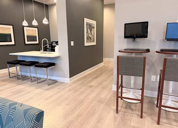 Clubhouse with recreation center, gaming lounge and fireplace