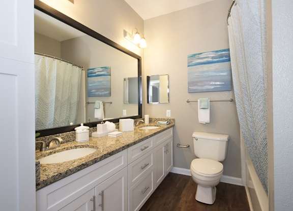 Dual vanities and framed mirrors in bathrooms