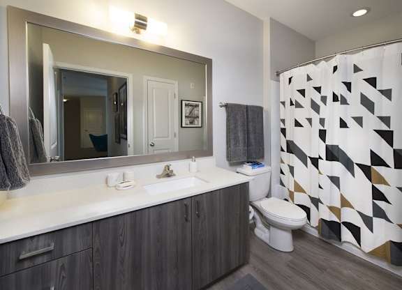 Garden soaking tubs with curved shower rods