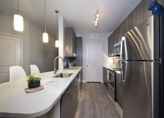 Kitchen with 42inch wall cabinets and quartz countertops