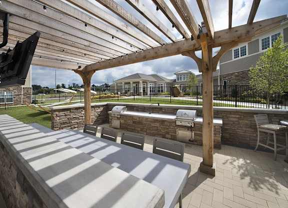 Outdoor living space with gas grills and fire pit