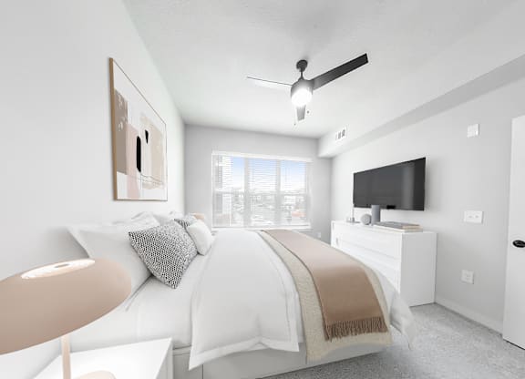 3-bedroom townhome second bedroom with overhead lighting and ceiling fan