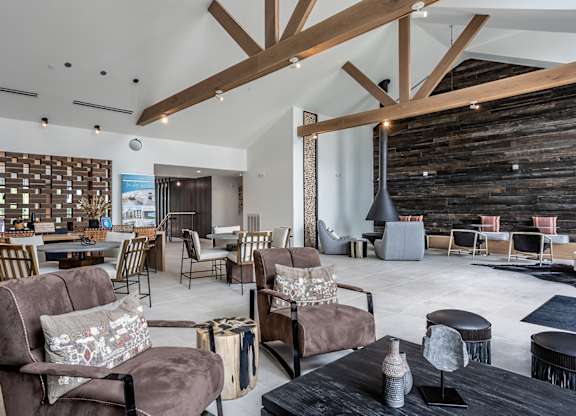 Multi-story clubhouse house with lounge seating and coffee bar