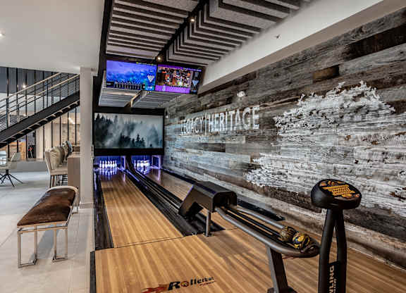 Indoor gaming lounge with billiards, foosball table, shuffleboard and mini bowling lane