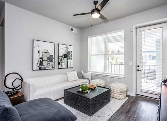Living room and patio with storage in model