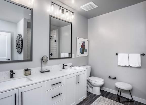 Dual vanities and framed mirrors in bathrooms