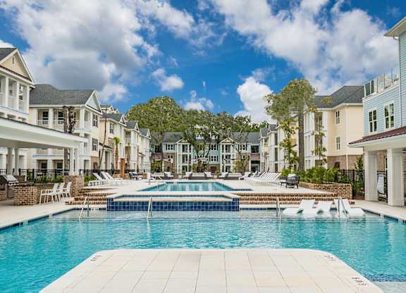 Bi-level saltwater pool with sundeck, cabanas and outdoor TV