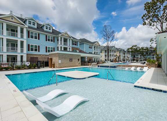 Bi-level saltwater pool with sundeck, cabanas and outdoor TV