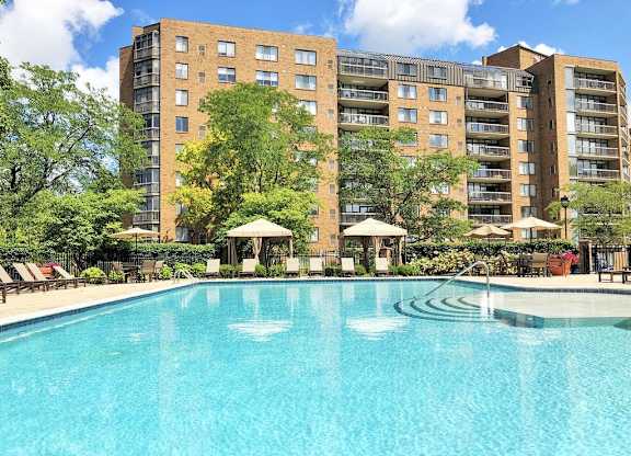 Pool with cabanas and sunshelf