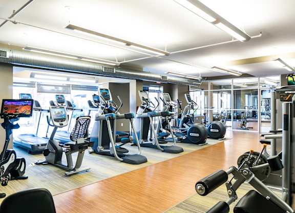 Professional fitness studio with Pilates/yoga zone, virtual training & Precor equipment