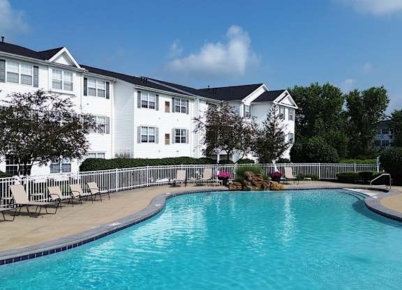 Heated outdoor pool with cascading waterfall