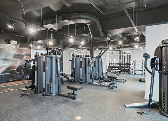 Weight machines in bi-level fitness studio