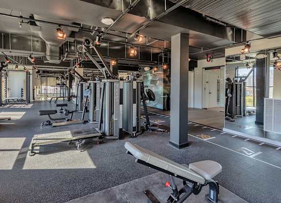 Bi-level fitness studio with weight machines