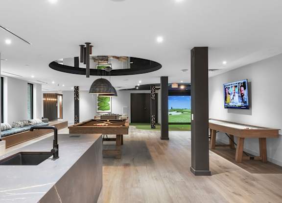 Social kitchen, pool table, virtual golf, and shuffleboard in gaming lounge
