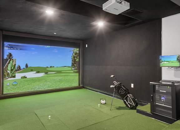 Virtual golf simulator in gaming lounge