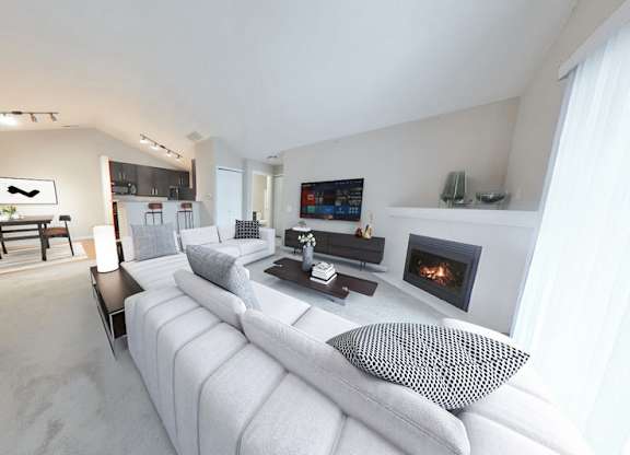 Spacious living rooms with fireplaces in select suites