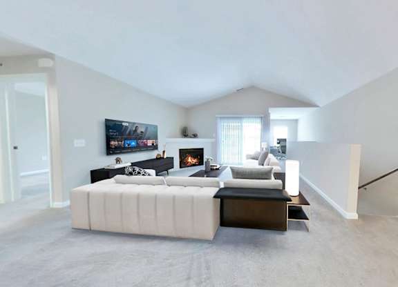 Spacious living rooms with fireplaces in select suites
