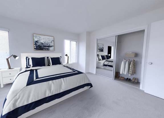 Bedroom with wall-to-wall oversized mirrored closet