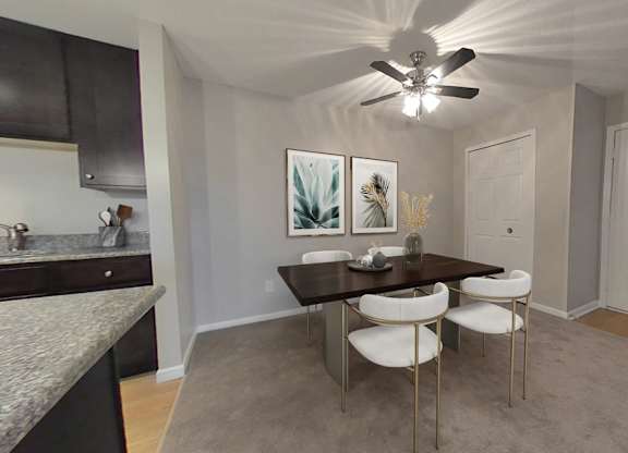 Dining rooms with overhead lighting and ceiling fan