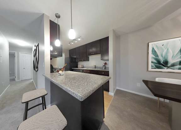 Deluxe 2-bedroom suites available with granite countertops and dark espresso cabinetry