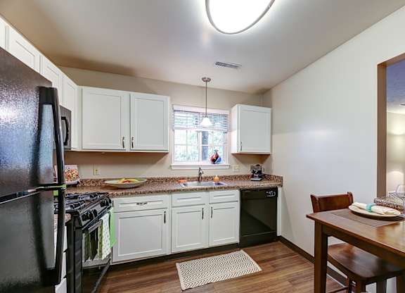 Newly renovated suites with sleek black appliances