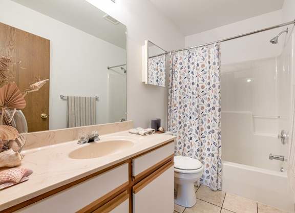 Bathroom with shower and bathtub