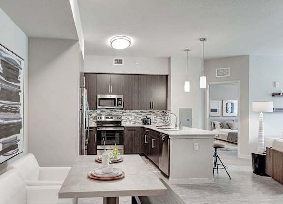 Beautiful dining area next to open concept upscale kitchen