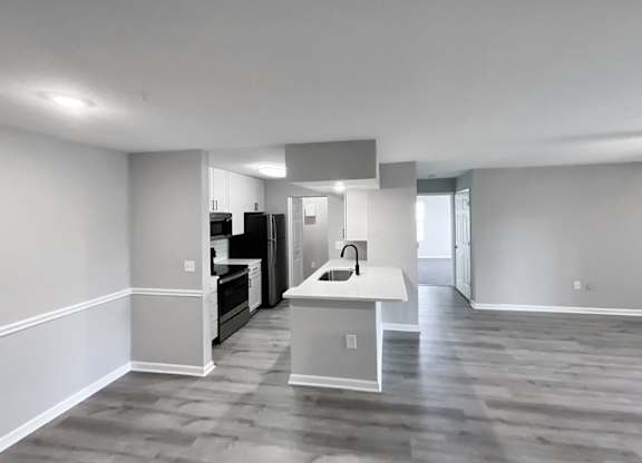 Plenty of room for entertaining in this epic kitchen/dining/living area at Cypress Grand Apartments