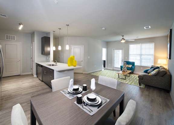 Hardwood-inspired flooring in living room and kitchen areas