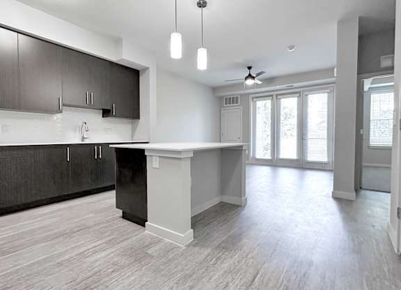 Open-concept floor plans with hardwood-inspired flooring