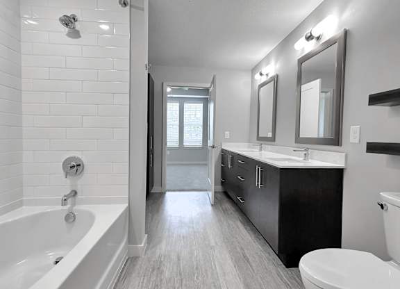 Garden soaking tubs with curved shower rods and tub to ceiling tile backsplash