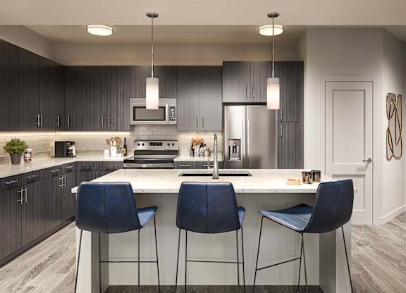 Quartz countertops and islands with overhead lighting
