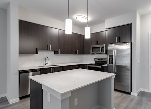 Fully-equipped kitchens with quartz countertops