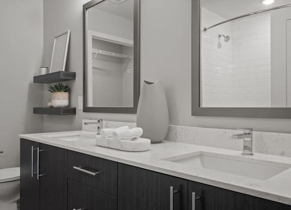 Dual vanities and framed mirrors in bathrooms