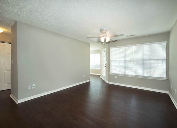 Open concept living areas with hardwood-inspired flooring (Signature)