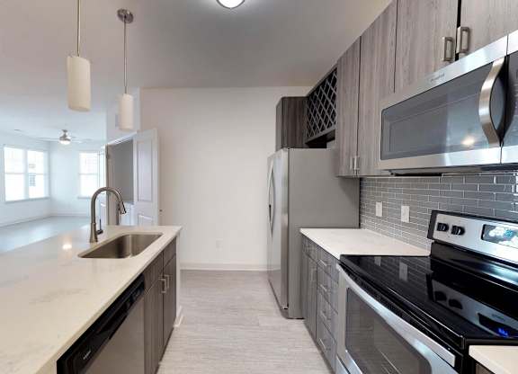 Chef's kitchens feature islands with quartz countertops