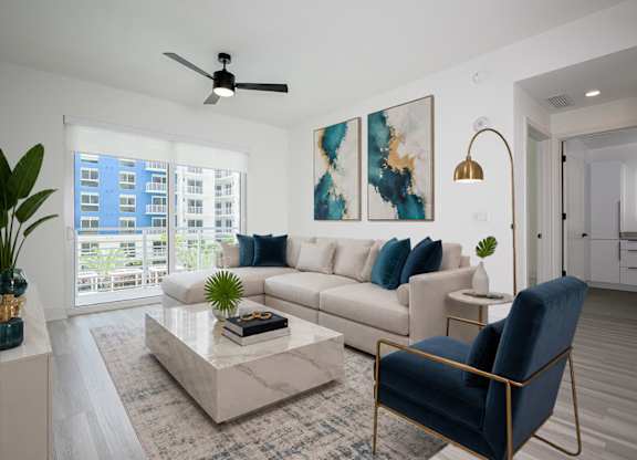 Spacious living area with hardwood-inspired flooring throughout