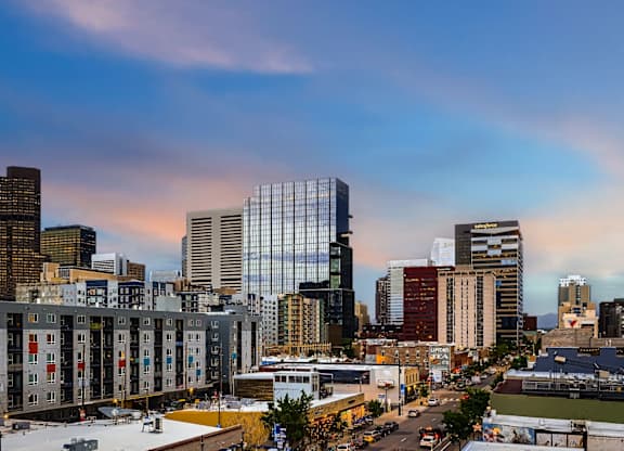 A cityscape with buildings and a clear sky.
