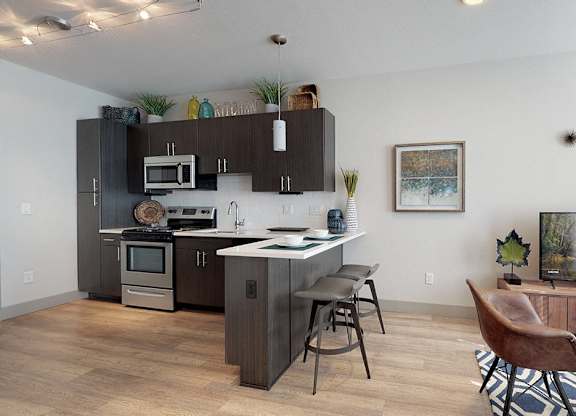 A modern kitchen with dark wood cabinets and a large island.