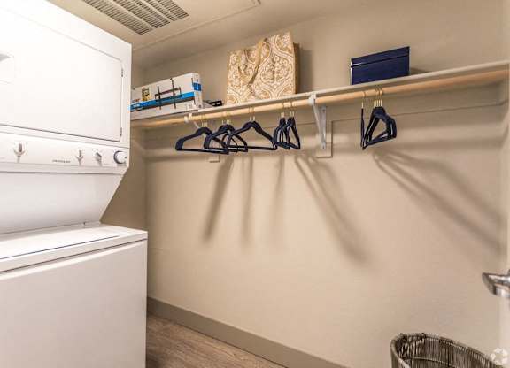 A laundry room with a washing machine and a clothes dryer.