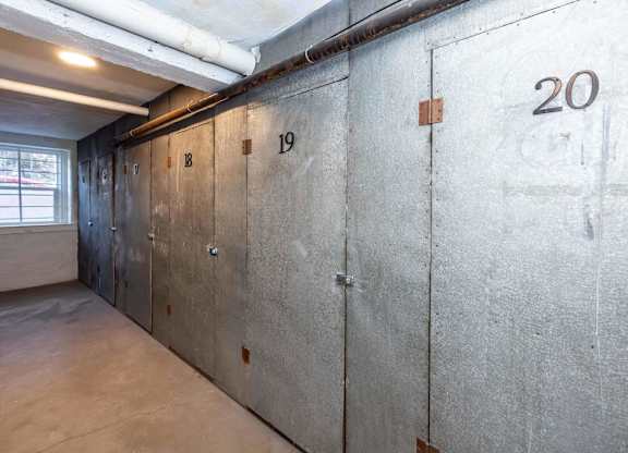A row of concrete lockers numbered 19 and 20.