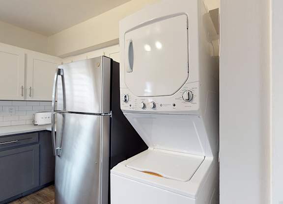 A white oven and refrigerator in a kitchen.