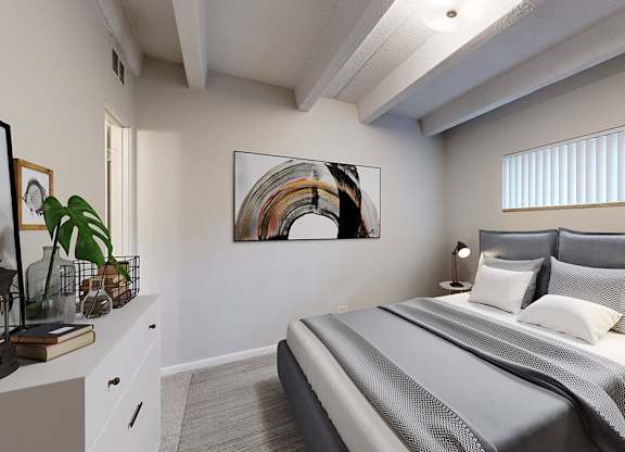 A bedroom with a large bed and a painting on the wall.