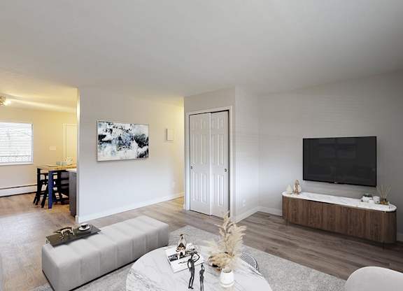 A modern living room with a grey sofa and a wooden coffee table.