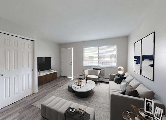 A modern living room with a grey sofa and a white door.
