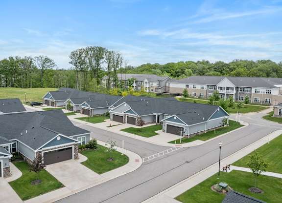 A suburban neighborhood with houses and a clear sky.