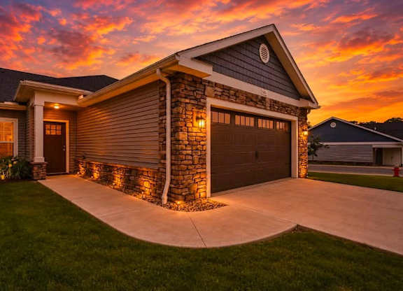 A house with a garage and a driveway.