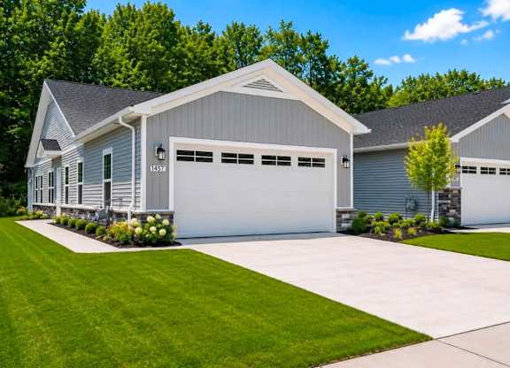 A two-car garage is attached to a house.