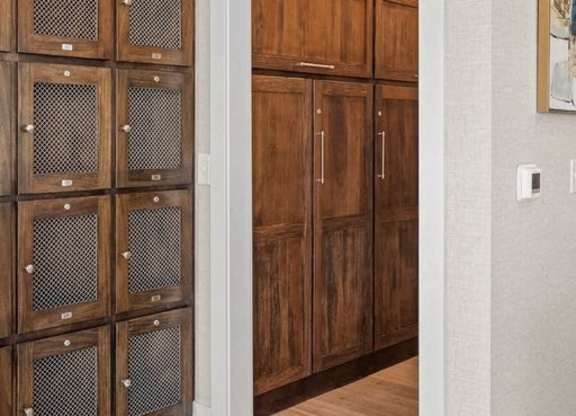 A set of wooden doors with glass panels on the left side.