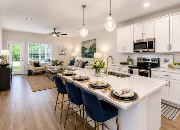 A kitchen with a dining table set for four.